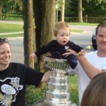 Young fan enjoying the cup with his parents