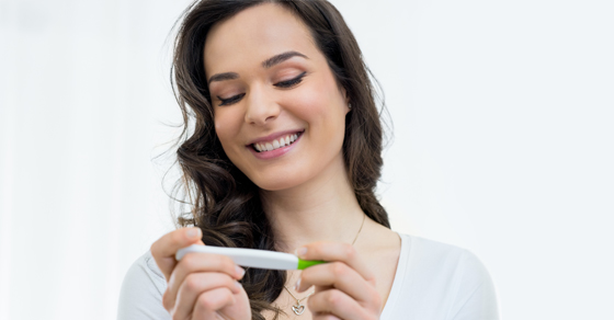 Woman Looking At Pregnancy Test